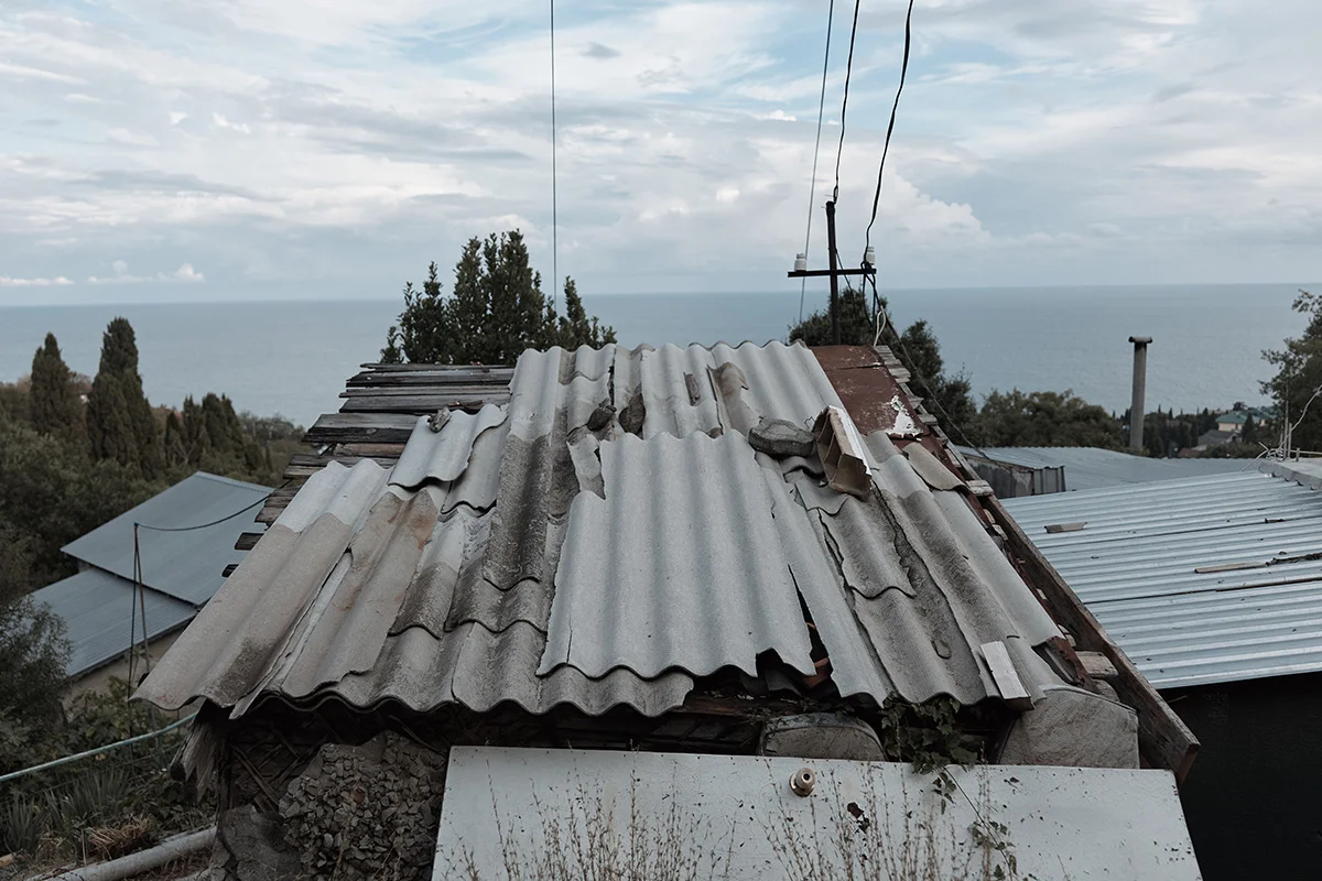 Severely damaged asbestos roof requiring professional HSA licensed removal in Ireland